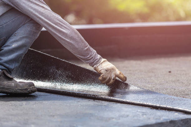 Professional Waterproofing technician working in Columbiana, AL